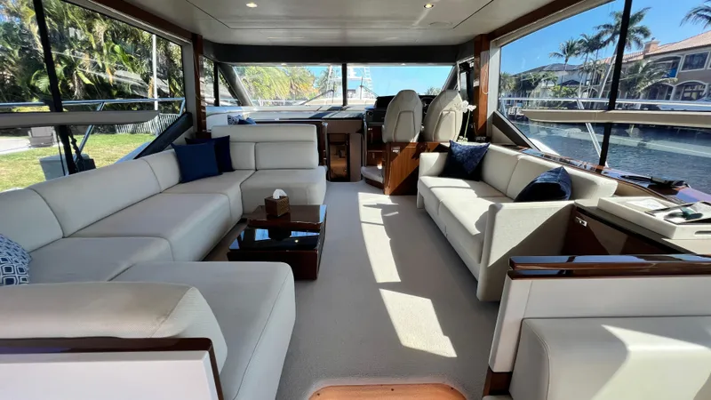  Yacht Photos Pics Luxurious interior of a 2019 Princess F62 yacht with elegant seating and panoramic windows.