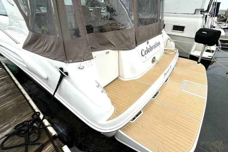  Yacht Photos Pics 1998 Sea Ray 400 Sundancer yacht docked, featuring a spacious rear deck and canopy.