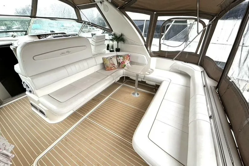  Yacht Photos Pics Luxurious interior of 1998 Sea Ray 400 Sundancer yacht with plush seating and elegant decor.