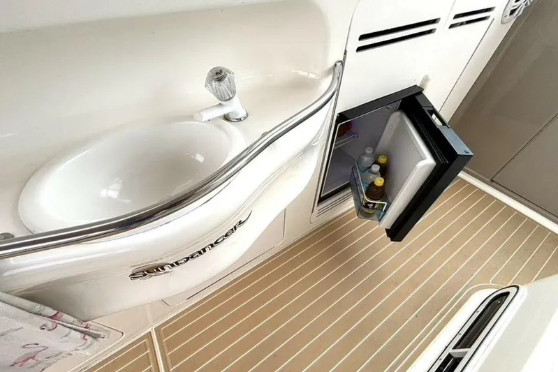  Yacht Photos Pics 1998 Sea Ray 400 Sundancer interior with sink and open mini fridge.