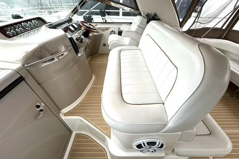  Yacht Photos Pics 1998 Sea Ray 400 Sundancer interior with white leather seating and modern dashboard.