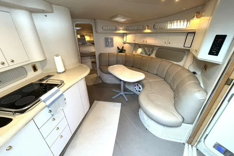  Yacht Photos Pics Luxurious interior of 1998 Sea Ray 400 Sundancer yacht with kitchen and seating area.