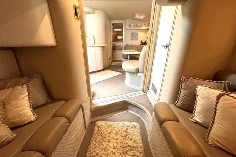  Yacht Photos Pics Luxurious interior of a 1998 Sea Ray 400 Sundancer yacht with cozy seating and elegant decor.
