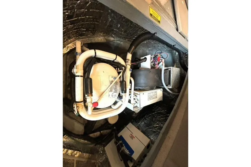  Yacht Photos Pics Engine compartment of a 1998 Sea Ray 400 Sundancer, showcasing mechanical components and wiring.