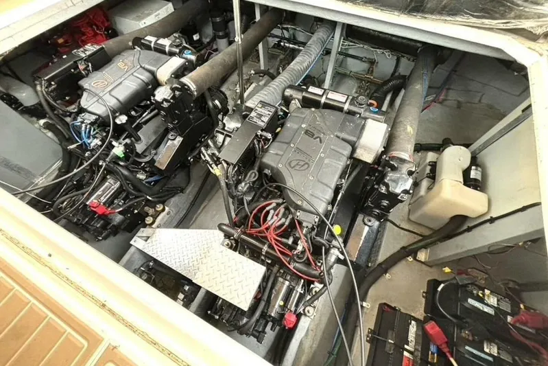  Yacht Photos Pics Engine compartment of a 1998 Sea Ray 400 Sundancer boat, showcasing dual engines and wiring.