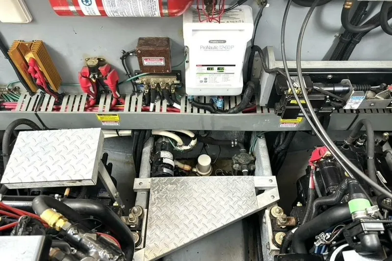  Yacht Photos Pics Engine room of 1998 Sea Ray 400 Sundancer with electrical components and wiring.