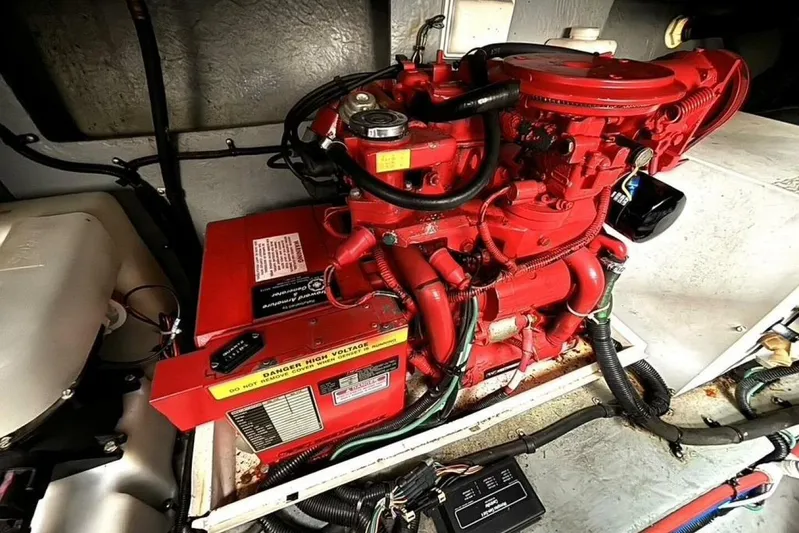  Yacht Photos Pics Engine compartment of a 1998 Sea Ray 400 Sundancer boat, featuring a red engine.