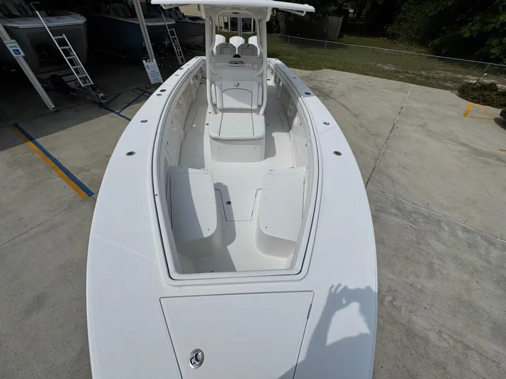  Yacht Photos Pics 2018 Jupiter 34 HFS boat, white exterior, docked on concrete surface, viewed from above.