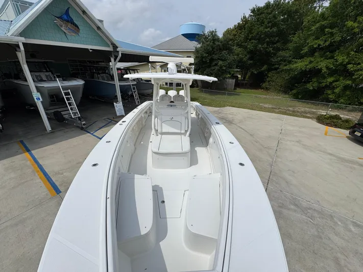  Yacht Photos Pics 2018 Jupiter 34 HFS boat docked at a marina with trees in the background.