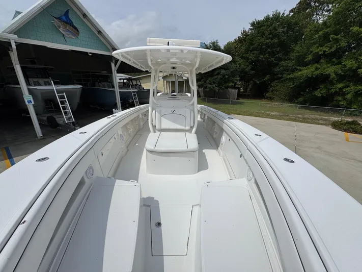  Yacht Photos Pics 2018 Jupiter 34 HFS boat with spacious deck and center console, parked outdoors.