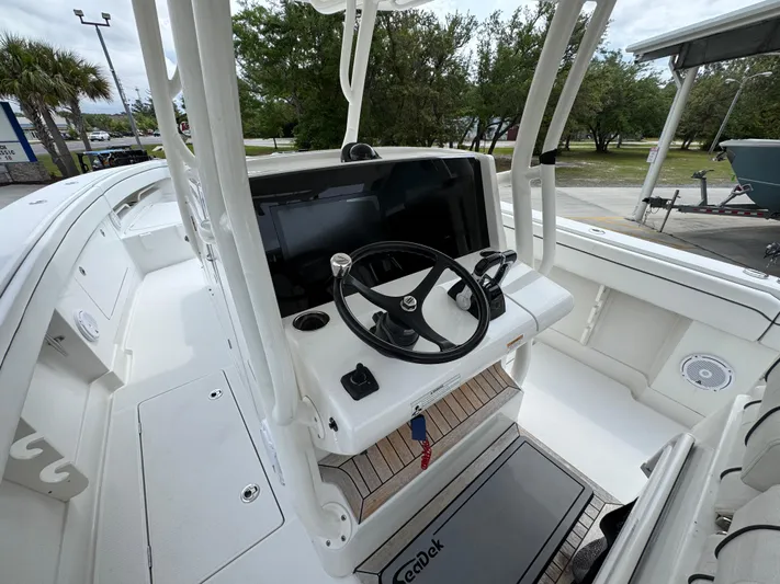  Yacht Photos Pics 2018 Jupiter 34 HFS boat helm with steering wheel and navigation display.