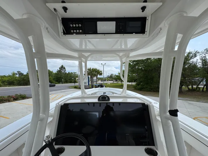  Yacht Photos Pics 2018 Jupiter 34 HFS boat cockpit with steering wheel and control panel.