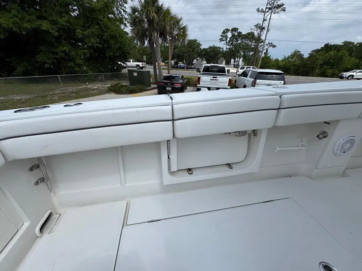  Yacht Photos Pics 2018 Jupiter 34 HFS boat interior with white cushioned seating and storage compartments.