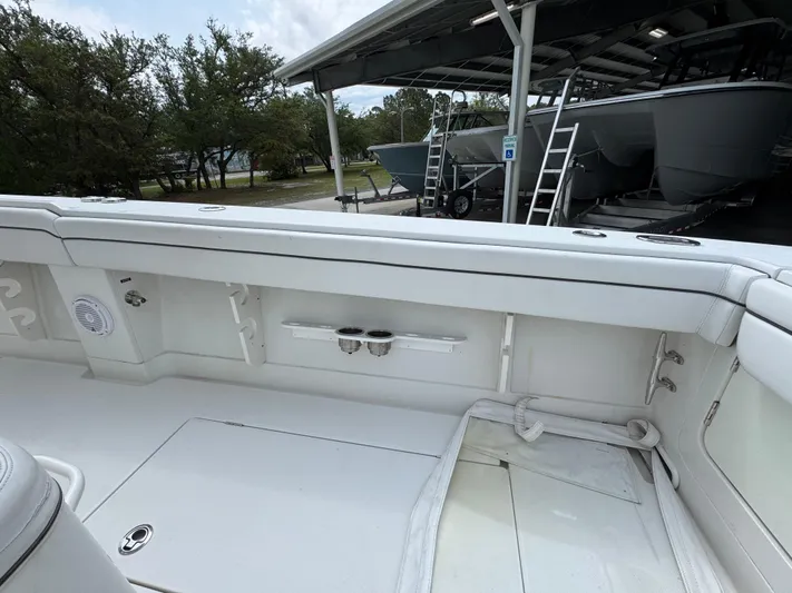  Yacht Photos Pics 2018 Jupiter 34 HFS boat interior with white seating and storage compartments.