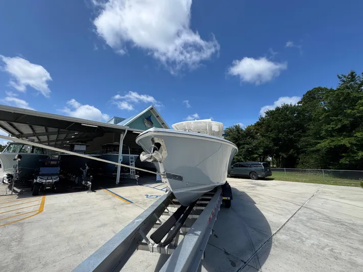  Yacht Photos Pics 2018 Jupiter 34 HFS boat on trailer under clear blue sky.