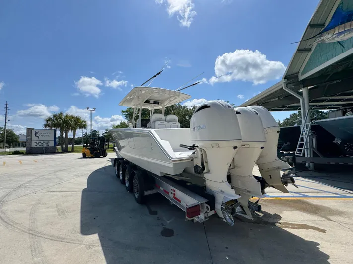  Yacht Photos Pics 2018 Jupiter 34 HFS boat on trailer under clear blue sky.
