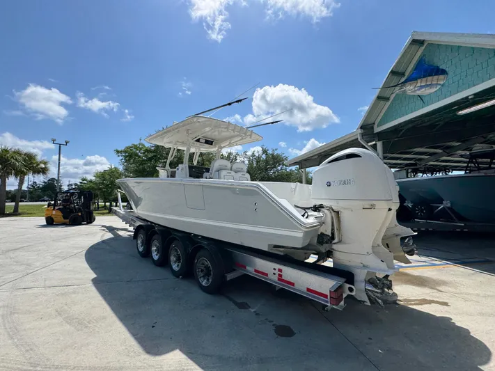  Yacht Photos Pics 2018 Jupiter 34 HFS boat on trailer under clear blue sky.