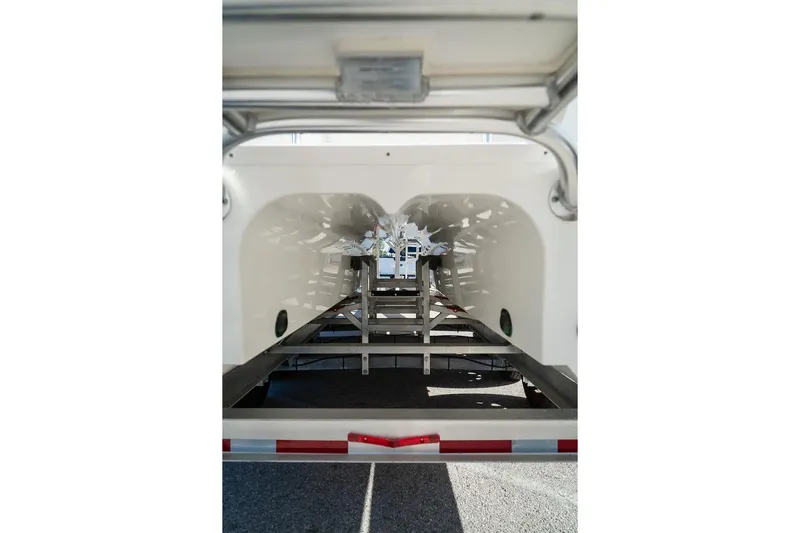  Yacht Photos Pics 2024 World Cat 295 CC boat hull on trailer, showcasing dual hull design.