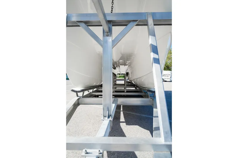  Yacht Photos Pics 2024 World Cat 295 CC boat hull on trailer, showcasing underside structure.