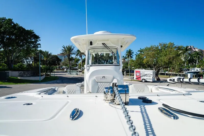  Yacht Photos Pics 2024 World Cat 295 CC boat docked, showcasing sleek design and modern features.