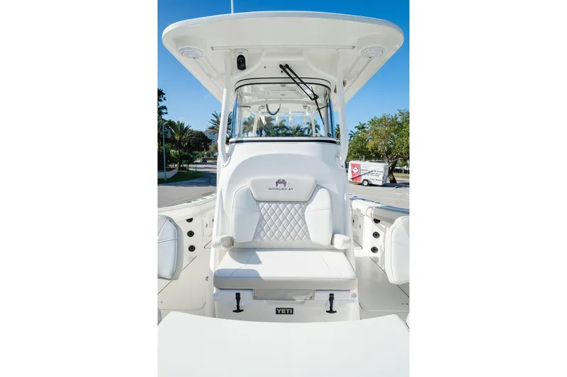  Yacht Photos Pics 2024 World Cat 295 CC boat interior with white seating and helm station.