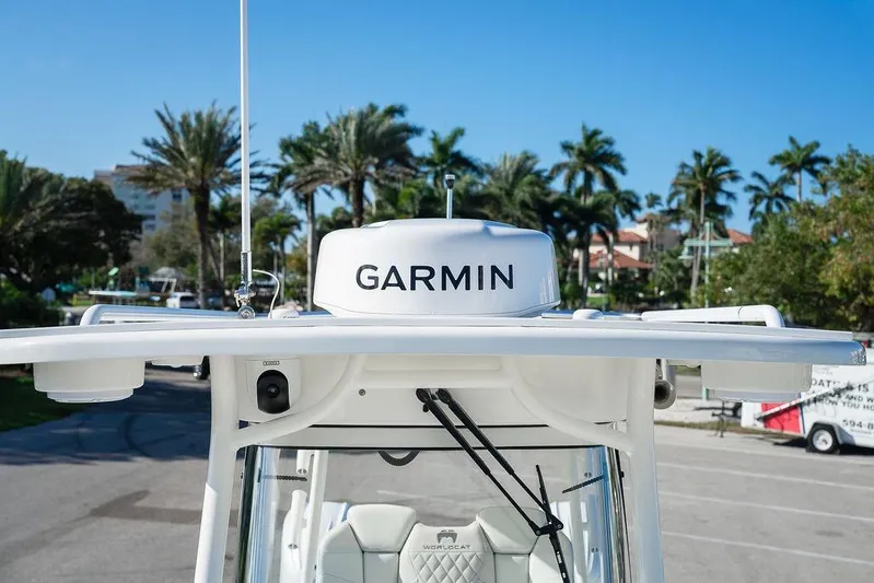 Yacht Photos Pics 2024 World Cat 295 CC boat with Garmin radar, palm trees in background.