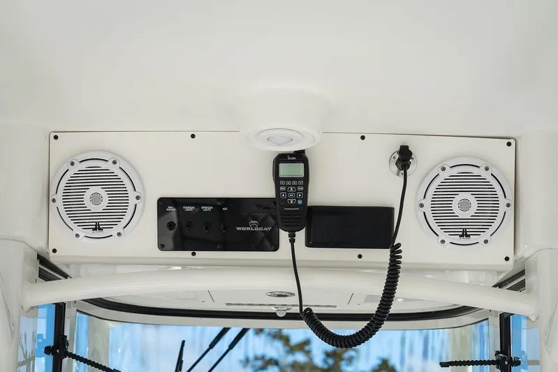  Yacht Photos Pics 2024 World Cat 295 CC boat dashboard with speakers and communication equipment.