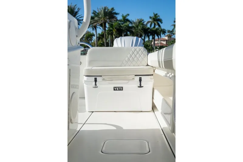 Yacht Photos Pics 2024 World Cat 295 CC boat interior with Yeti cooler and cushioned seating.