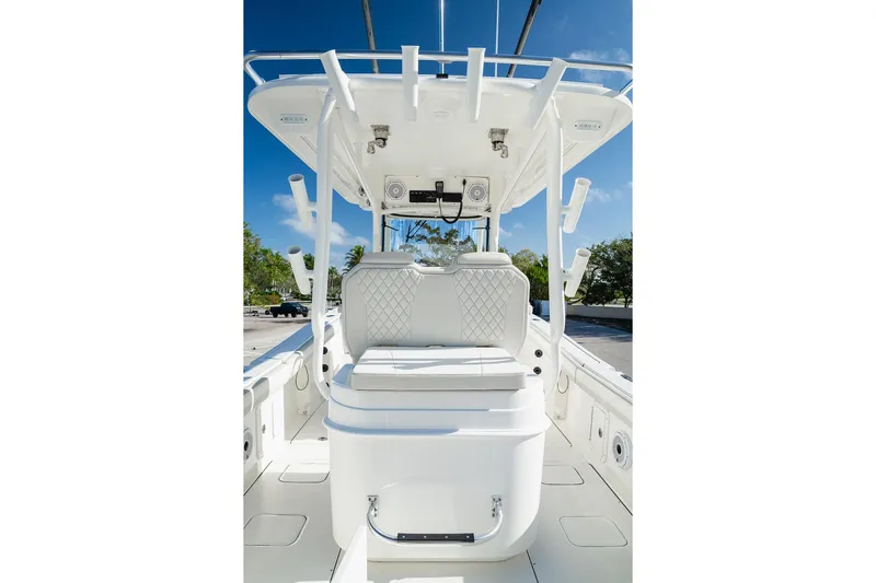  Yacht Photos Pics 2024 World Cat 295 CC boat interior with white seating and rod holders.