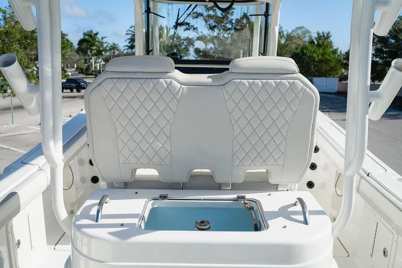  Yacht Photos Pics 2024 World Cat 295 CC boat interior with diamond-stitched seating and livewell.