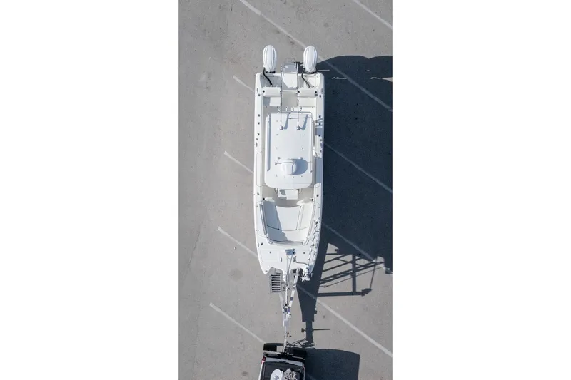 Yacht Photos Pics Aerial view of 2024 World Cat 295 CC boat on trailer in parking lot.