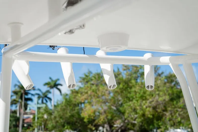  Yacht Photos Pics Rod holders on a 2024 World Cat 295 CC boat against a clear blue sky.