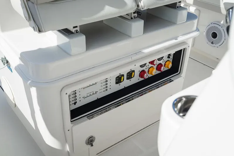  Yacht Photos Pics 2024 World Cat 295 CC boat control panel with switches and seating.