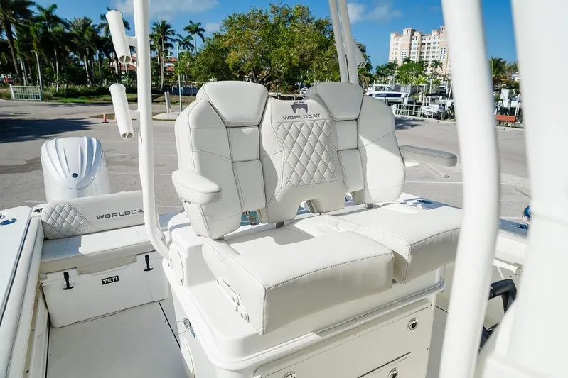  Yacht Photos Pics 2024 World Cat 295 CC boat interior with luxurious white seating and modern design.