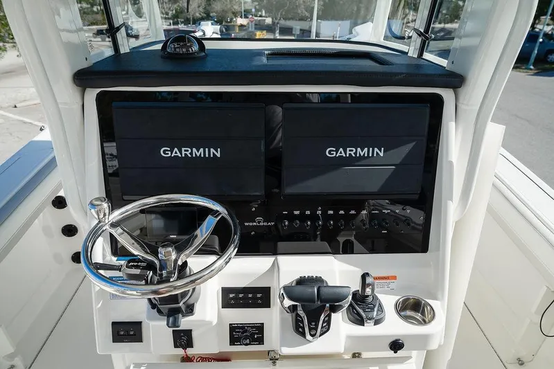  Yacht Photos Pics 2024 World Cat 295 CC helm with Garmin displays and modern controls.
