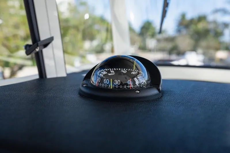  Yacht Photos Pics Compass on 2024 World Cat 295 CC boat dashboard, indicating direction.