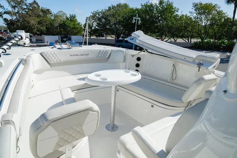  Yacht Photos Pics 2024 World Cat 295 CC boat interior with white seating and round table.