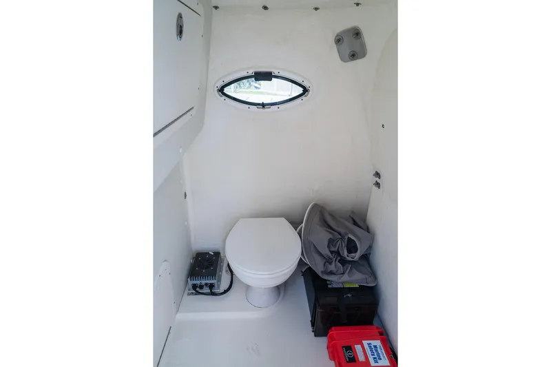  Yacht Photos Pics Interior of 2024 World Cat 295 CC boat featuring a compact marine toilet.