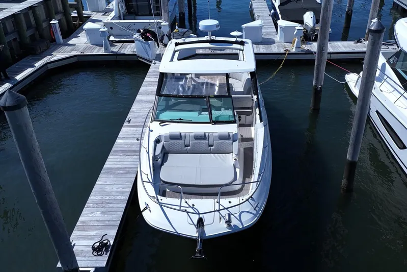  Yacht Photos Pics 2023 Sea Ray Sundancer 320 docked at marina, aerial view.