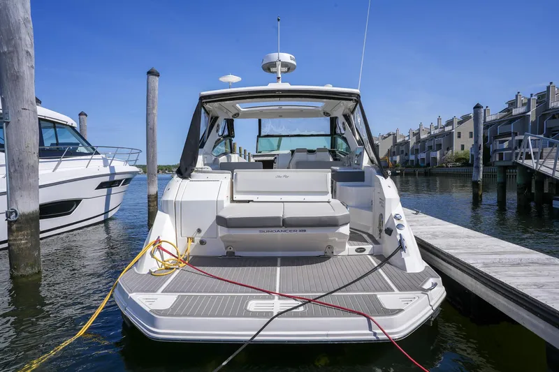  Yacht Photos Pics 2023 Sea Ray Sundancer 320 docked at marina, rear view with open deck.