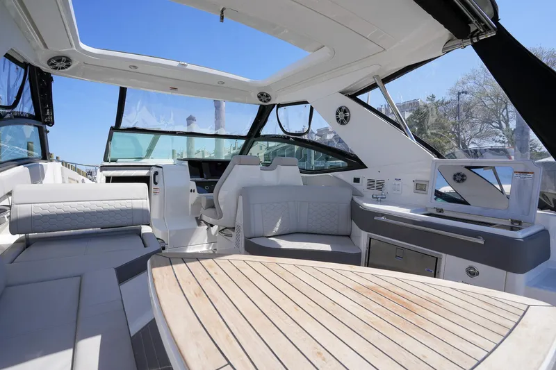  Yacht Photos Pics 2023 Sea Ray Sundancer 320 interior with luxurious seating and modern amenities.