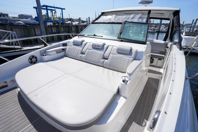  Yacht Photos Pics 2023 Sea Ray Sundancer 320 yacht with spacious seating area at the marina.