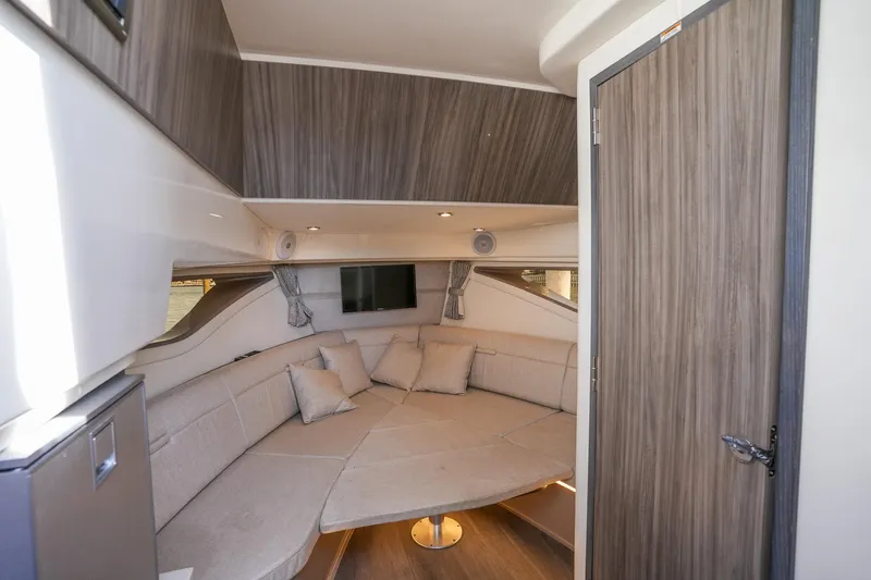  Yacht Photos Pics 2023 Sea Ray Sundancer 320 interior with cozy seating and modern design.