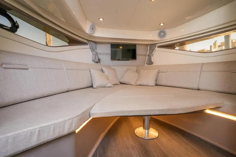  Yacht Photos Pics Luxurious interior of 2023 Sea Ray Sundancer 320 yacht with plush seating and modern design.