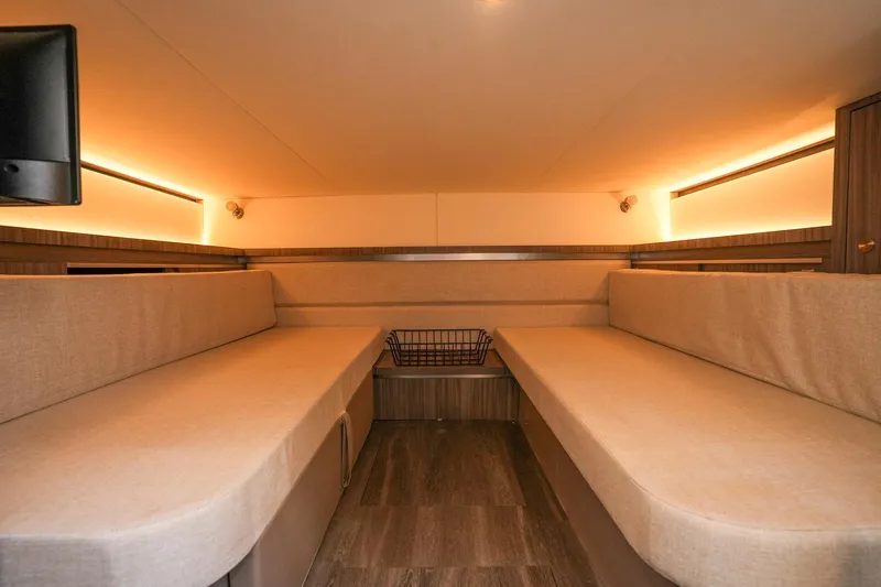  Yacht Photos Pics 2023 Sea Ray Sundancer 320 cabin interior with cozy seating and ambient lighting.