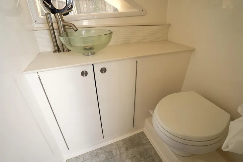  Yacht Photos Pics 2023 Sea Ray Sundancer 320 bathroom with modern sink and toilet.