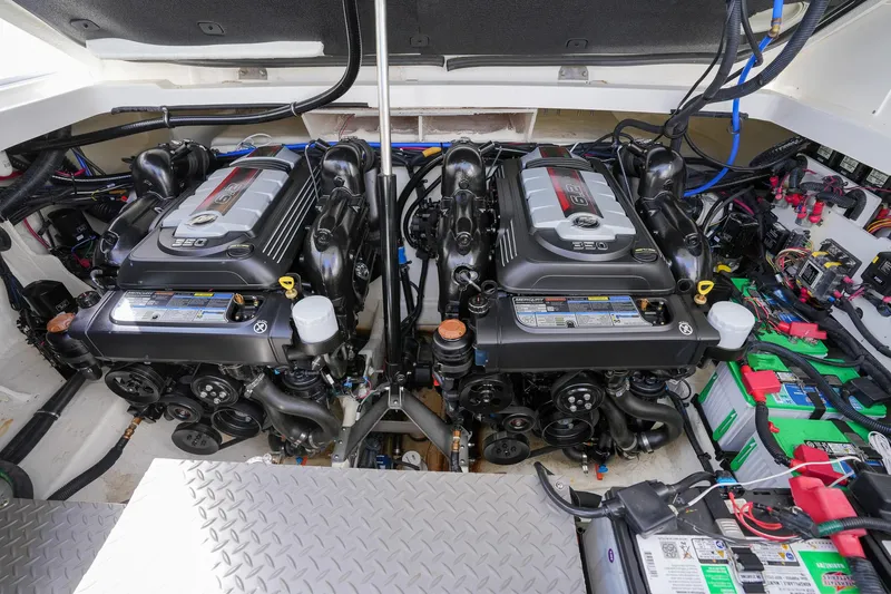  Yacht Photos Pics Engine room of 2023 Sea Ray Sundancer 320 with dual engines and battery setup.