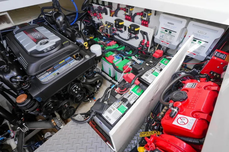  Yacht Photos Pics Engine compartment of 2023 Sea Ray Sundancer 320, showcasing batteries and wiring systems.