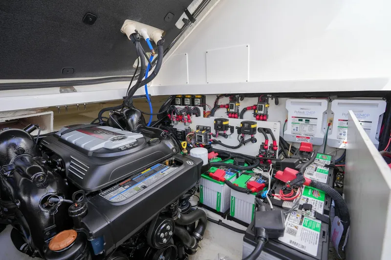  Yacht Photos Pics Engine compartment of 2023 Sea Ray Sundancer 320, showcasing batteries and wiring.