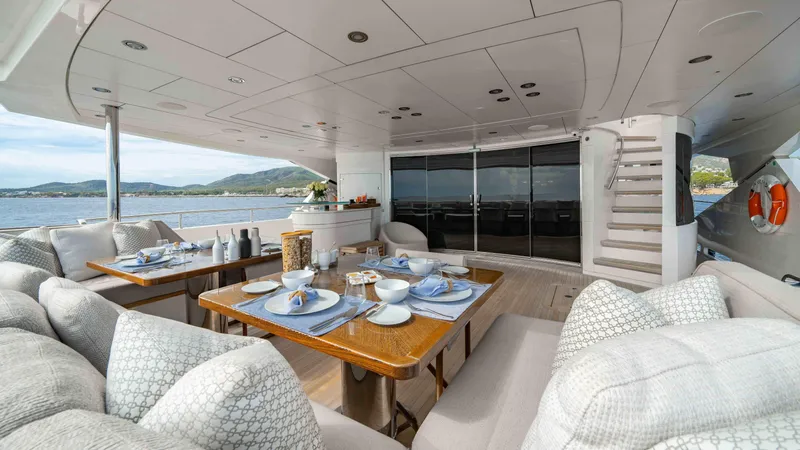  Yacht Photos Pics Luxurious Sunseeker 131 Yacht 2016 interior with elegant dining setup and scenic ocean view.